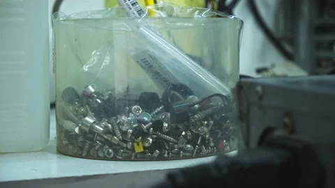 Jar with screws in the workshop. Workflow details around the workman. Stock Footage 130779536