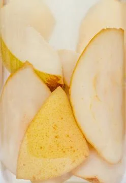 Jar with sliced pears compote, close up. Stock Photos