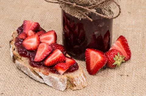 Jar with strawberry jam Stock Photos