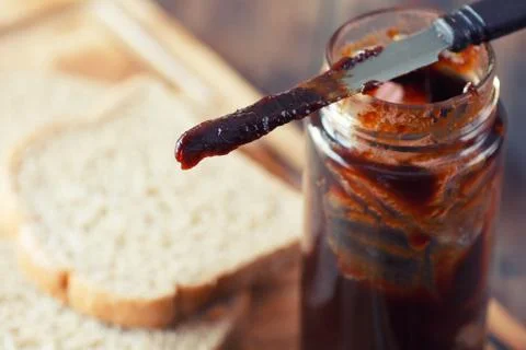 Jar of strawberry jam Stock Photos