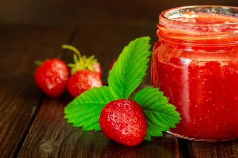 Jar of strawberry jam Stock Photos