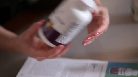 Jar of supplements pills in hand. Stock Footage 22240462