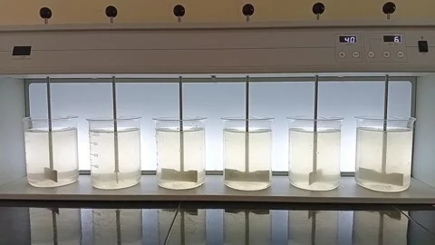 Jar Test Sequence: Initiating Slow Flocculation Process Stockbeeldmateriaal 333311089