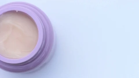 Jar with white cream on white background, top view, copy space Stock Footage 122190035