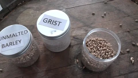 Jars of barley on a table Stock Footage 225337371