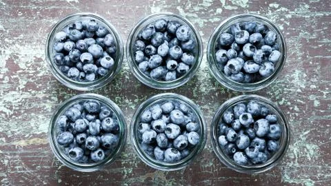 Jars with blueberries fruit Stock Photos