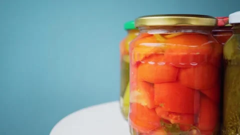 Jars of canned tomatoes and cucumbers for the winter. Stock Footage 250027042