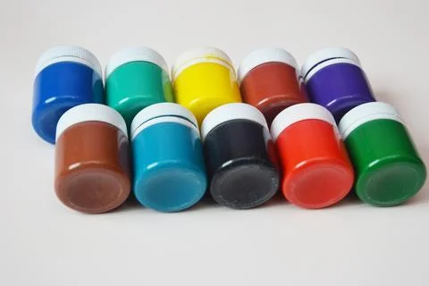 Jars with colored gouache for creativity. A set of white, blue, red paints. D Foto stock