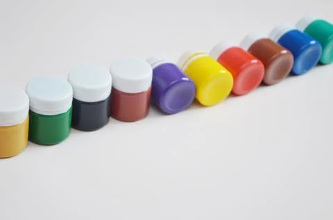 Jars with colored gouache for creativity. A set of white, blue, red paints. D Foto stock