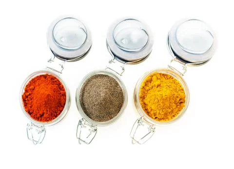 Jars of colourful ground spice Stock Photos