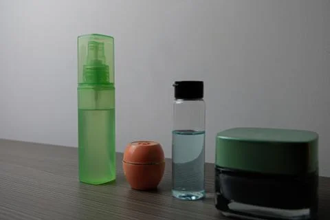 Jars with cosmetics on a grey background Stock Photos