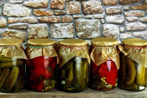 Jars with cucumbers tomatoes Stock Photos