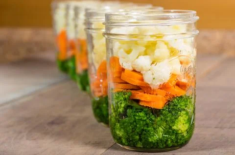 Jars of cut vegetables for canning 스톡 사진