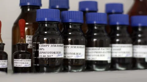 Jars of different medicines and solutions for testing factory products Stock Footage 90759129