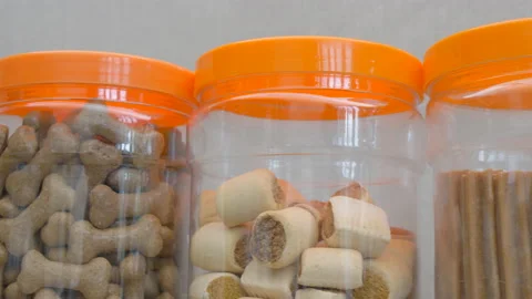 Jars of dog chews and biscuits. Stock Footage 140740658