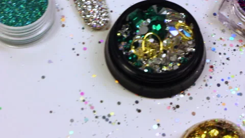 Jars with elements for nail design with rhinestones, sequins, beads, sparkles Stock Footage 147336965