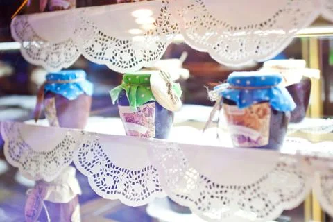 Jars with jam on a decorated openwork napkins showcase Stock Photos