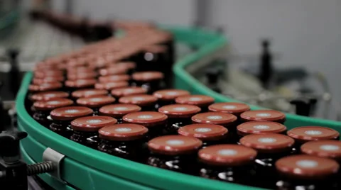 Jars with jam moving on conveyor belt in food Factory Stock Footage 33661243