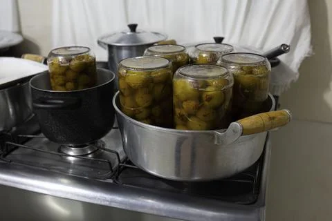 Jars with mangaba jam in a pan Stock Photos
