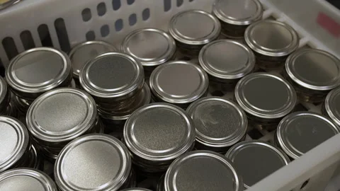 Jars with metal lids in a drawer Stock Footage 247254790