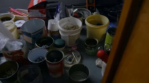 Jars with nails and bolts are on the table Stock-Footage 80188917