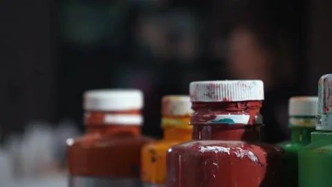 Jars of paint in the artist's workshop Stock Footage 228681339