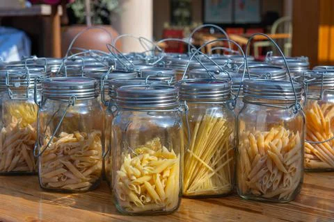 Jars of pasta are on the table Stock Photos