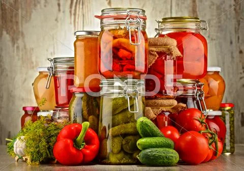 Jars With Pickled Vegetables And Fruity Compotes. Preserved Food