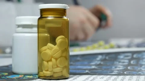 Jars with pills on table Stock-Footage 89870845