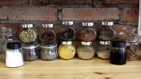 Jars of spices on the shelf Stock Footage 83733365