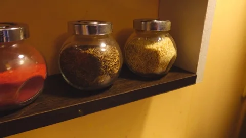 Jars with spices on shelves 库存影片 83932461