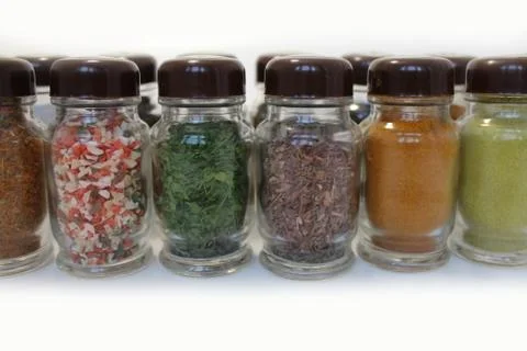 Jars with spices on white Foto stock