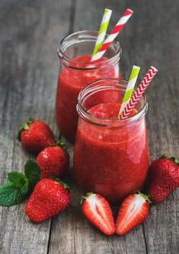 Jars with strawberry smoothie Stock Photos
