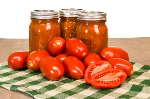 Jars of tomato sauce with paste tomatoes Stock Photos
