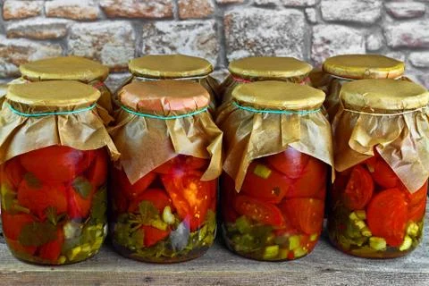 Jars with tomatoes Stock Photos