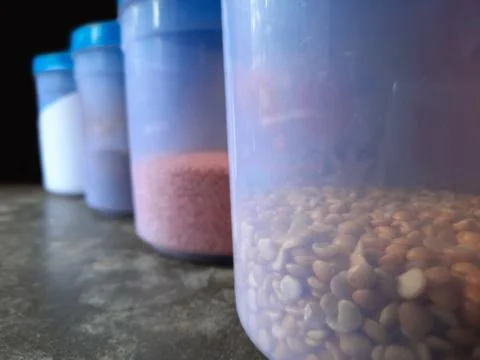 Jars with various spices in a kitchen selective focus Stock Photos