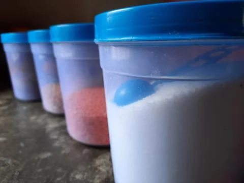 Jars with various spices in a kitchen selective focus Stock Photos