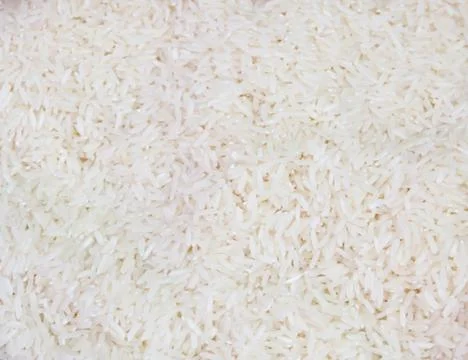 Jasmine rice with texture background Stock Photos