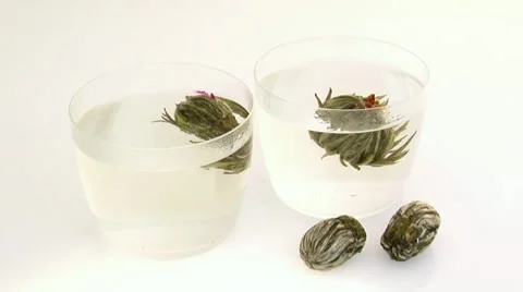 Jasmine tea flowers in two tea glasses Stock Footage 8570613