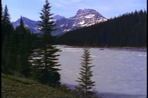Jasper National Park, Alberta, Canada, mountains, lake in foreground Stock Footage
