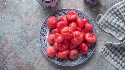 Java Apple, also known as a Rose Apple, Water Apple on a blue and white plate Stock Footage 340863405