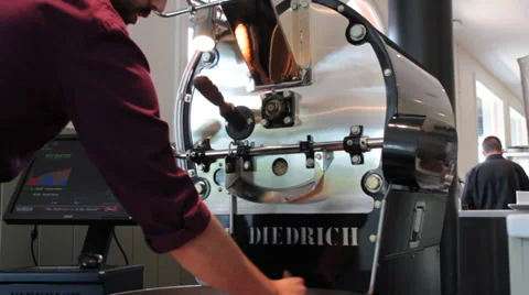 Java: Coffee Barista Cleaning the Roasted Bean Cooling Tray  Stock Footage 37255700