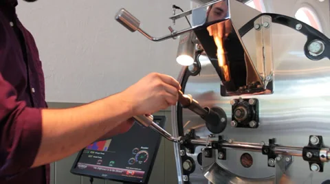 Java: Coffee Roaster Tests the Beans Stock Footage 37256361