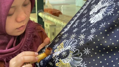 Java, Indonesia 06182022-Woman creates IKAT fabric Video stock 218570672
