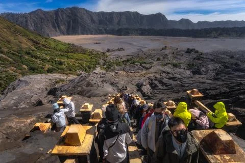 Java, Indonesia, 2 Oct 2024 Excited tourists trek along a scenic Bromo volcan Photos