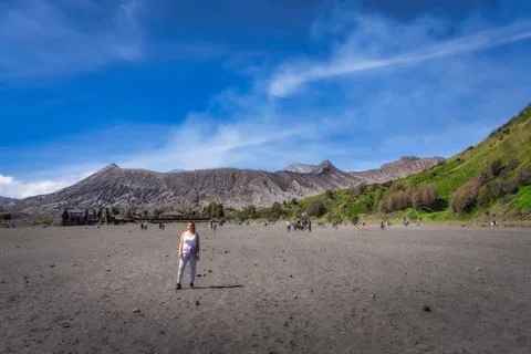 Java, Indonesia, 2 Oct 2024 A solitary figure walks thoughtfully across a Bro Photos