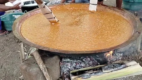 Java Indonesia 4 June 2026: Villagers work together to make traditional jenang. Stock Footage 336651034