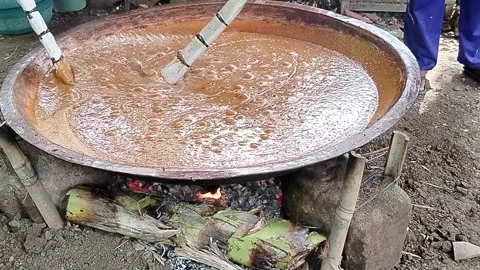 Java Indonesia 4 June 2026: Villagers work together to make traditional jenang. Stock Footage 336651036