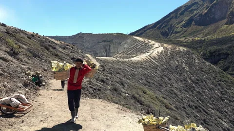 JAVA, INDONESIA - Ijen volcano, worker carrying heavy basket Stock Footage 59856123