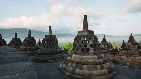 Java, Indonesia, Timelapse of Tourists at the Ancient Borobudur Temple, Zoom In Video stock 249318134